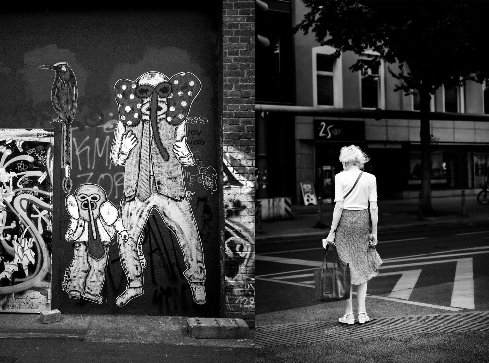 Eine Frau mit weißem Haar geht über eine Straße und kommt an einer Wand mit einem großen Graffiti vorbei, das zwei Figuren mit Elefantenköpfen zeigt. (KI-generierte Beschreibung)